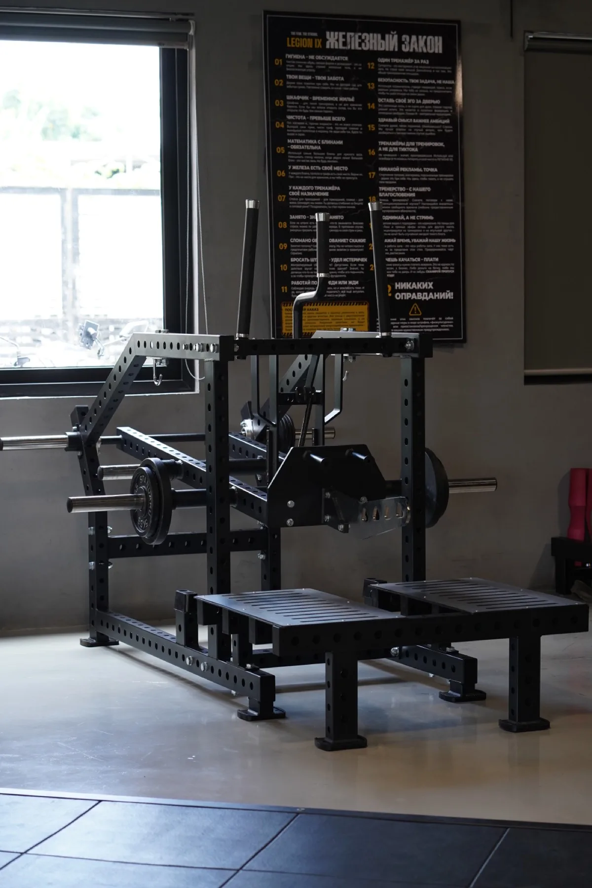 Belt squat machine on the LEGION IX training floor