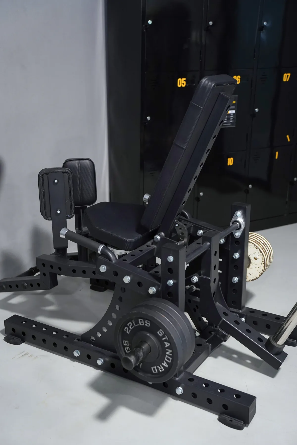 Plate-loaded hip abduction and adduction machine on the LEGION IX training floor
