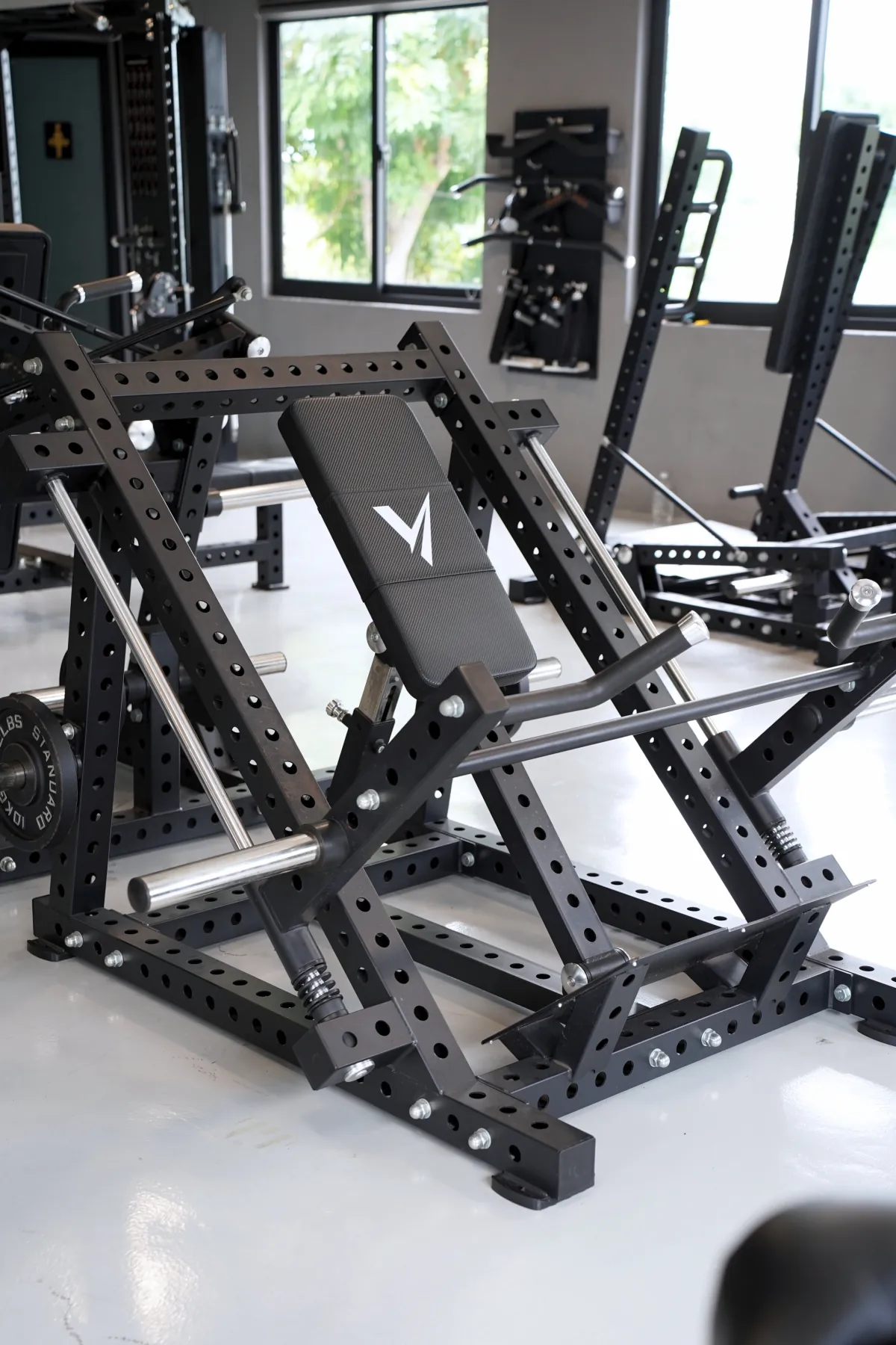 Seated dual-track row machine on the LEGION IX training floor