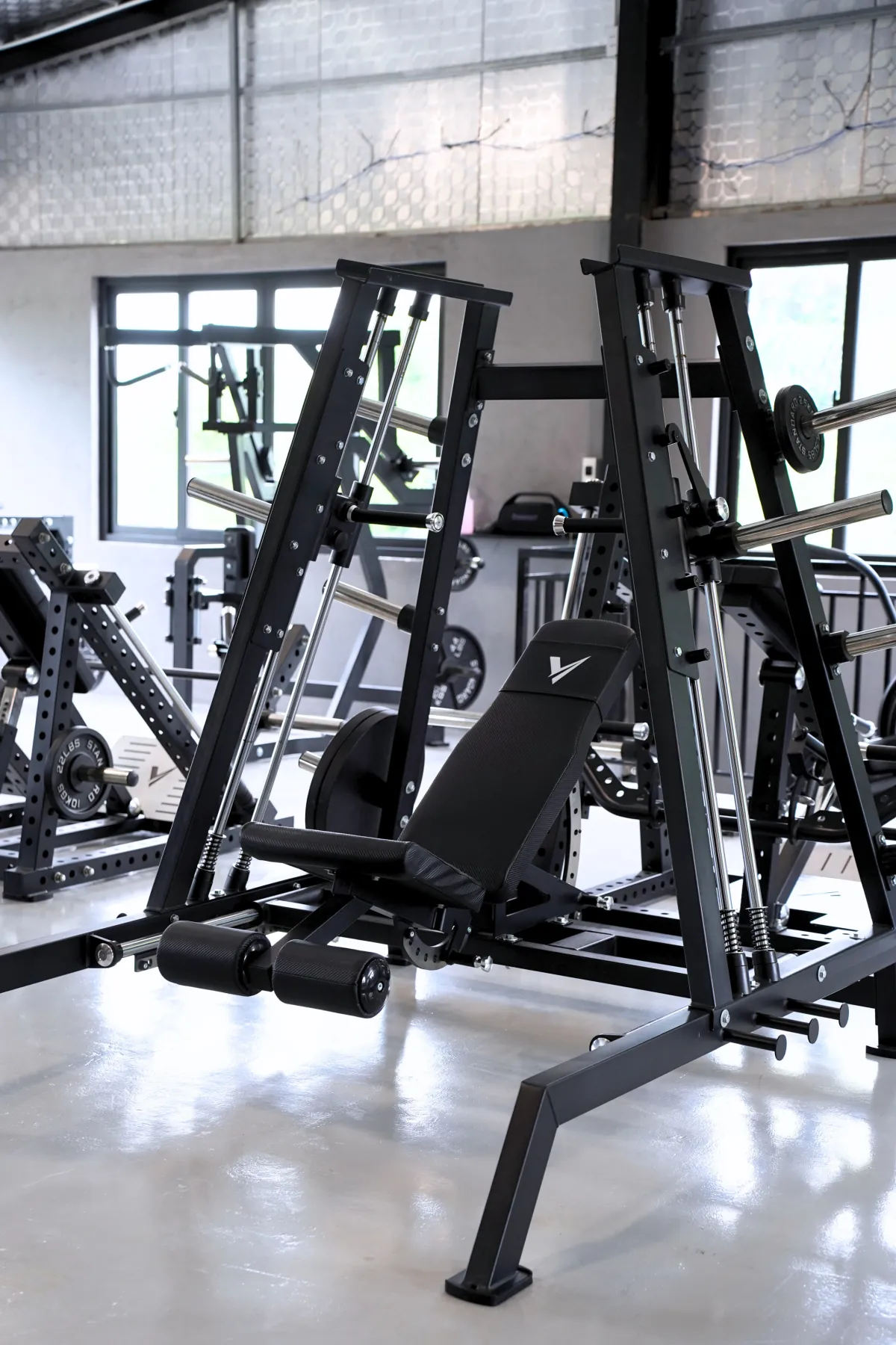 Smith chest press machine on the LEGION IX training floor