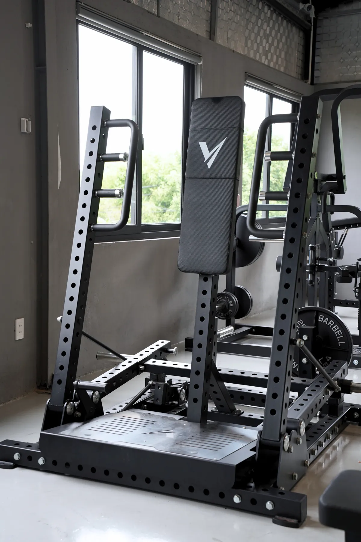 Standing chest press machine on the LEGION IX training floor